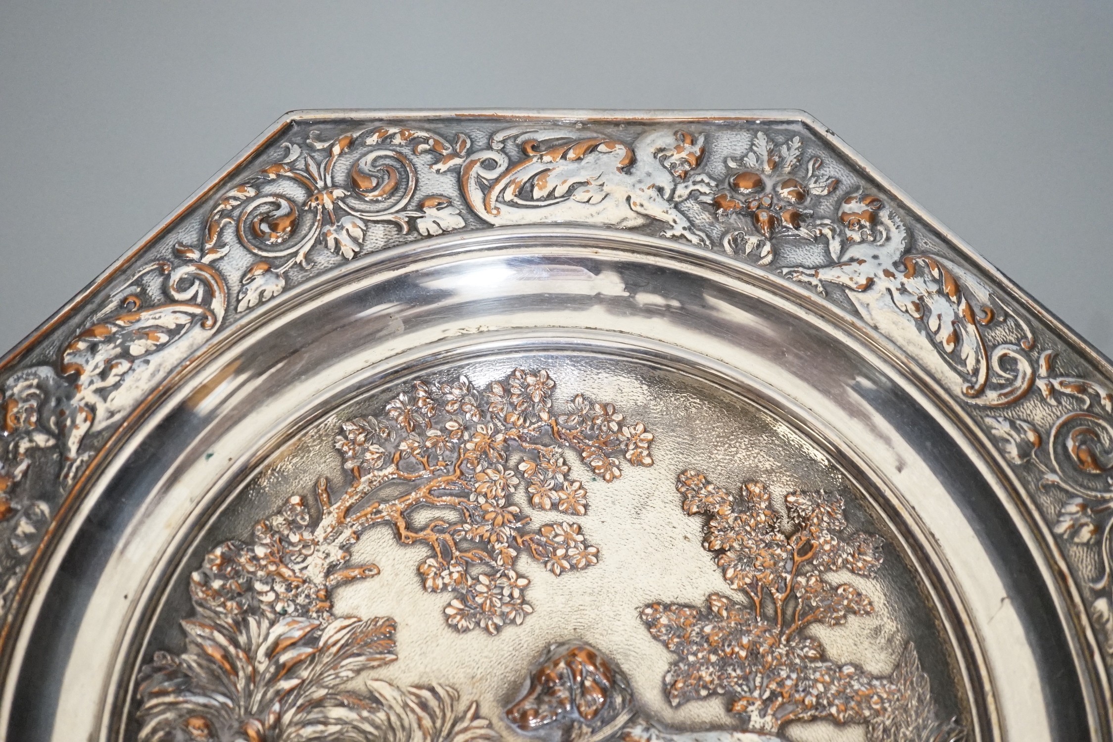 An early 20th century Elkington type silver plated tazza embossed with hunting dogs, 29cm